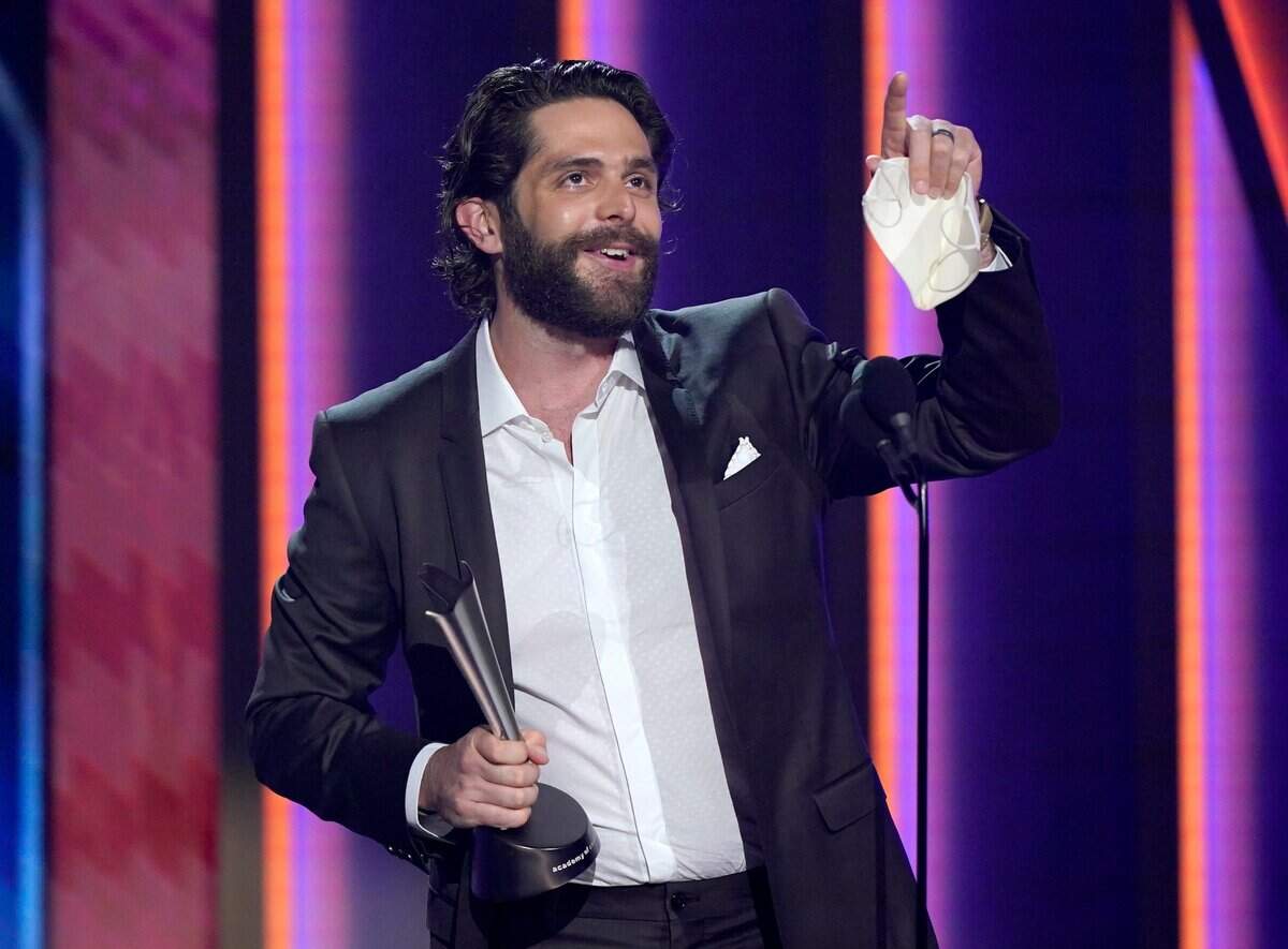 Thomas Rhett accepts the award for male artist of the year at the 56th annual Academy of Country Music Awards on Sunday night at the Grand Ole Opry in Nashville, Tenn.