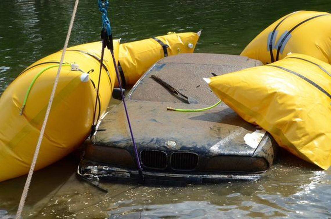Special air bags lift the BMW to the surface of Lake Wylie on Wednesday, Sept. 15, 2021.