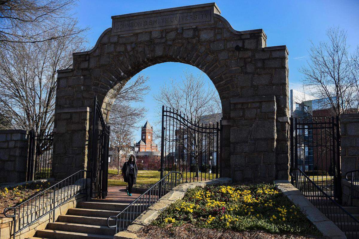 Christina Blackston, of Durham, N.C., an information systems major at Johnson C. Smith University exits campus along Beatties Ford Road in Charlotte, N.C., Wednesday, Feb. 2, 2022. Several historically black universities around Charlotte received bomb threats this week.