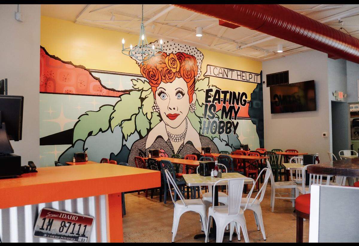 Pita Wheel in Belmont recently opened with an indoor dining room wall mural of comic great Lucille Bal, painted by local artist Erin Albertson.