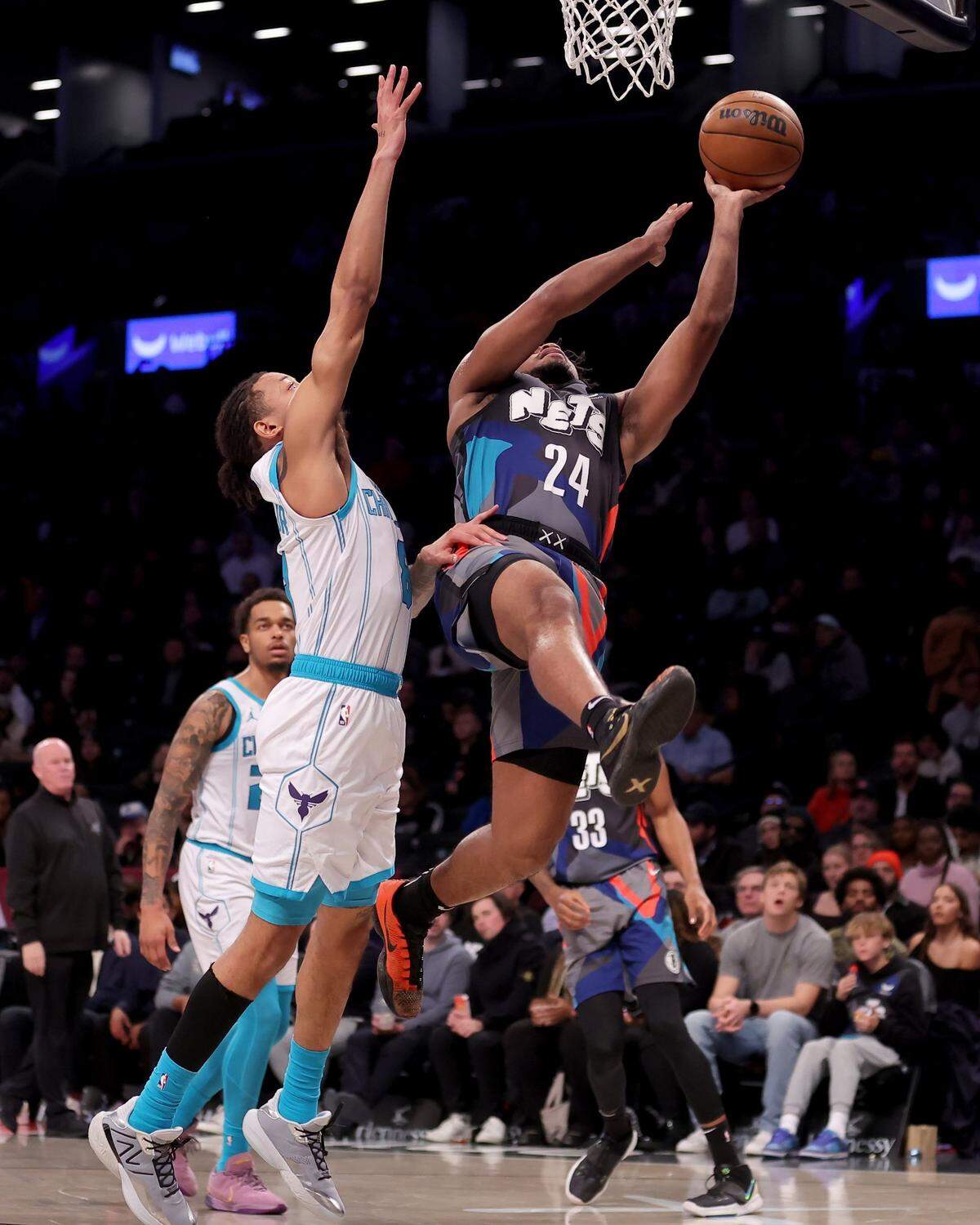  Brooklyn Nets guard Cam Thomas (24) shoots against Charlotte Hornets guard Nick Smith Jr. (8) during the second quarter at Barclays Center.