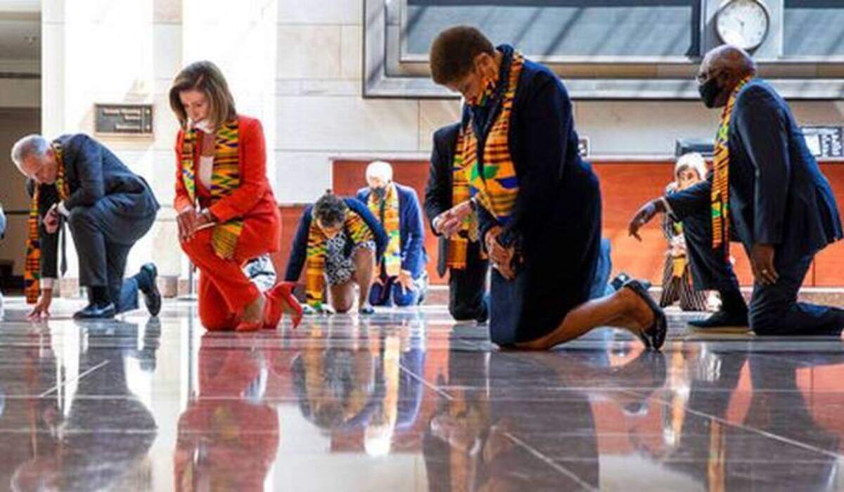 House Speaker Nancy Pelosi, center, and other members of Congress, kneel to observe a moment of silence to honor George Floyd and others killed during police interactions. On June 8 Democrats proposed a sweeping overhaul of police oversight and procedures called the Justice in Policing Act.