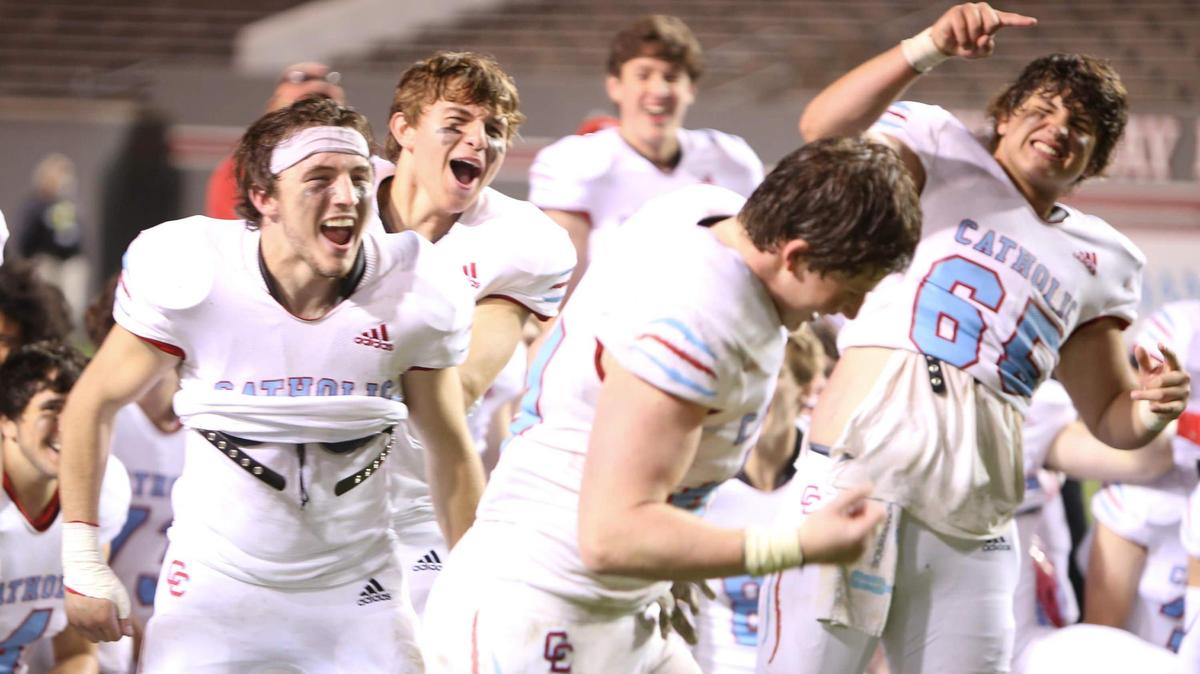 Charlotte Catholic’s players celebrate the announcement of their teammate, linebacker Liam Barbee (44), as the game’s most valuable player following the NCHSAA 3A State Championship football game between Charlotte Catholic and Havelock in Raleigh on Friday, May 7, 2021. Charlotte Catholic won the championship game 14-7.