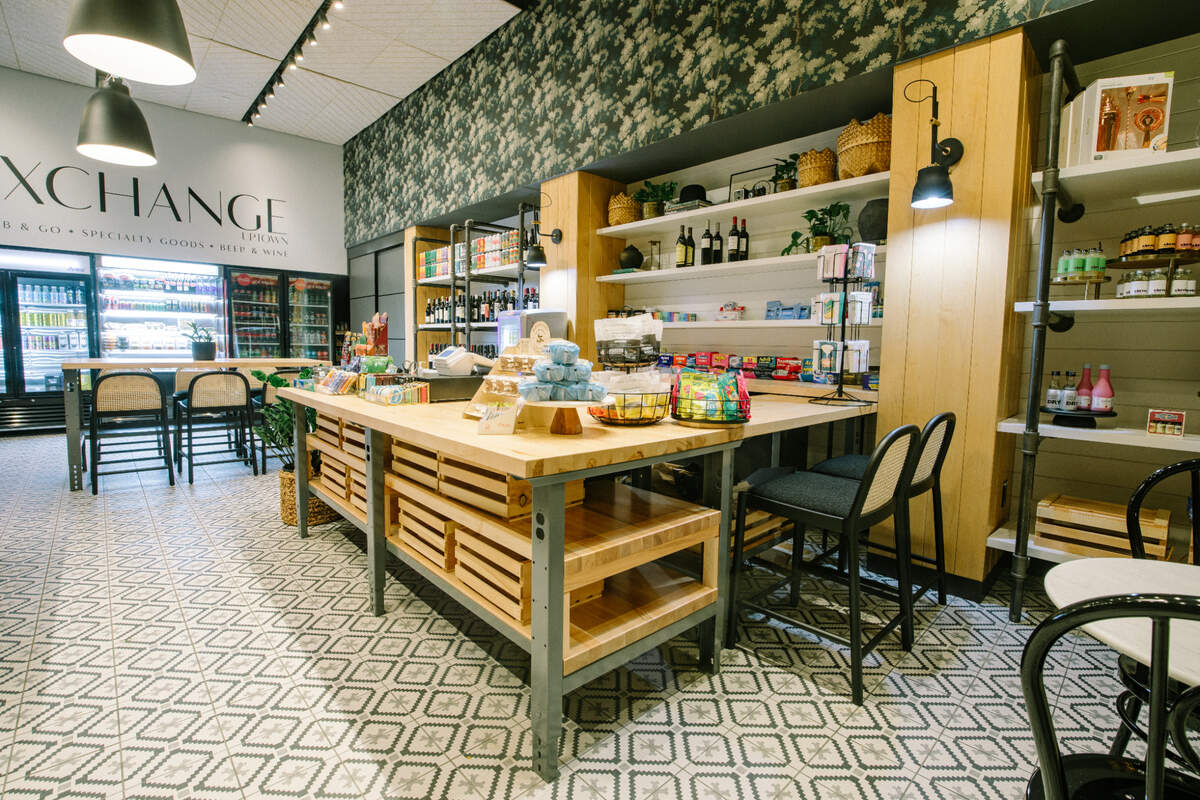 The Exchange uptown sells sodas and cold beverages, artisanal and specialty snacks, to-go sandwiches, greeting cards, gifts and beer and wine for retail purchases.