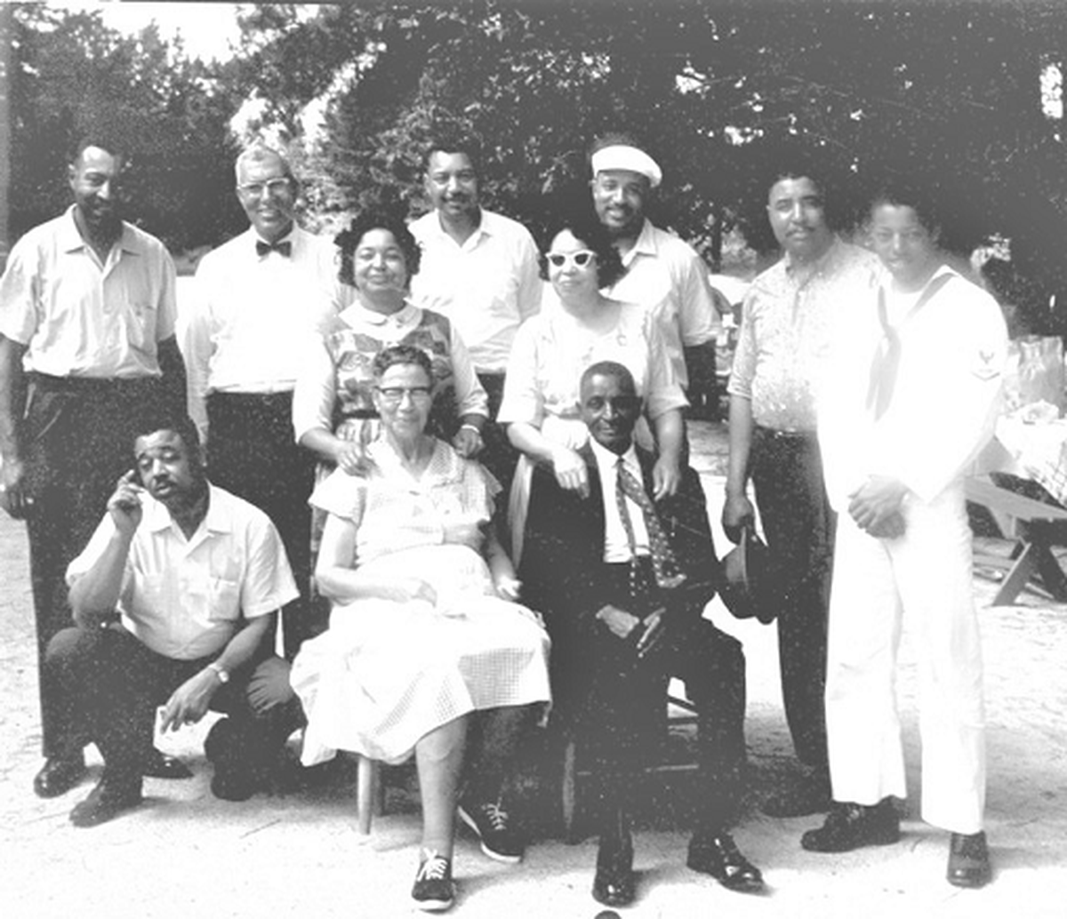 Founders of the Witherspoon-Strain family reunion, Rev. Willie and Daisy Strain Witherspoon, sit with family members at one of the earliest reunions at their home in Lancaster County, South Carolina.