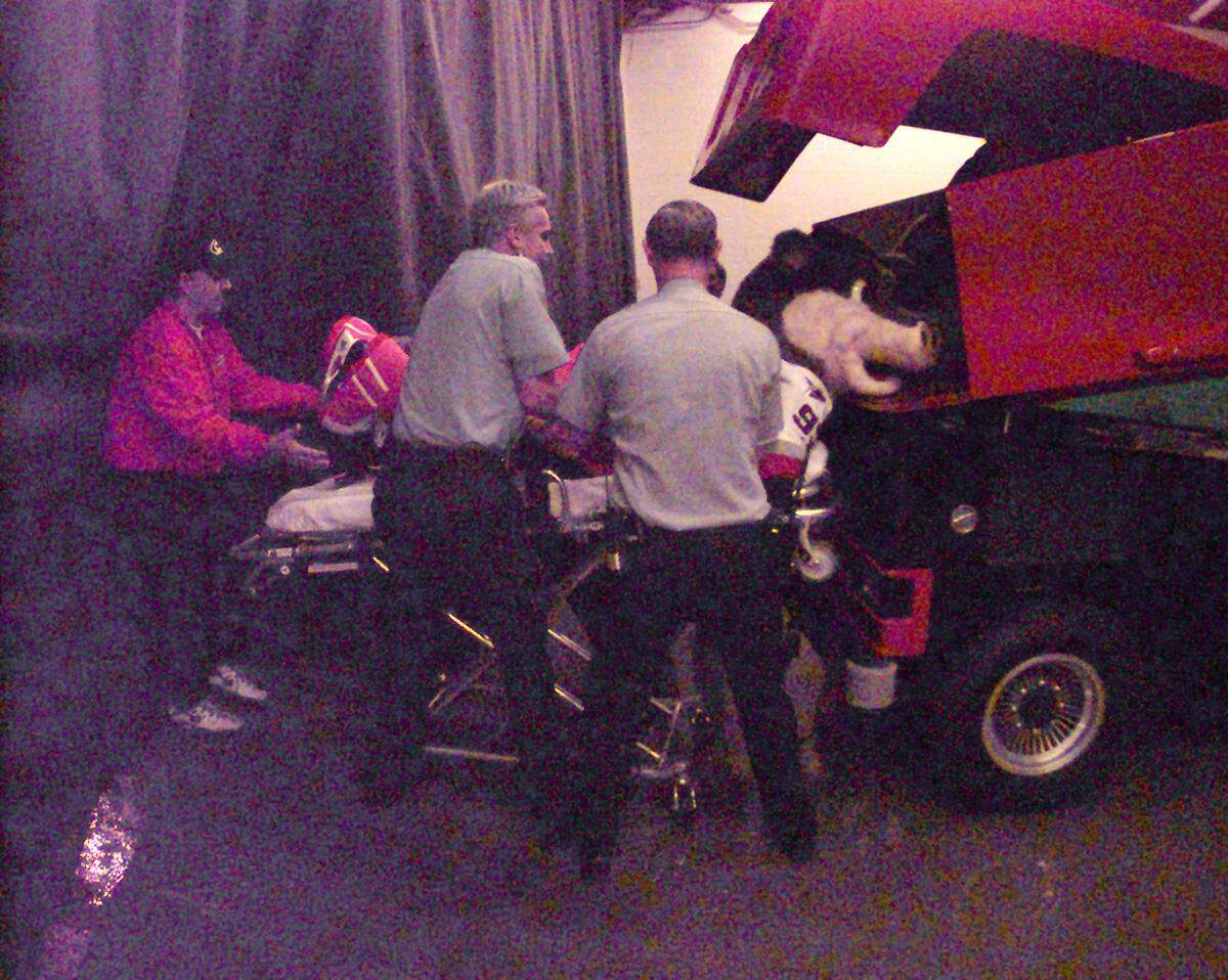 EMS works help Phil Madren from the Zamboni from which the Hurricanes new mascot was supposed to emerge on the ice.  