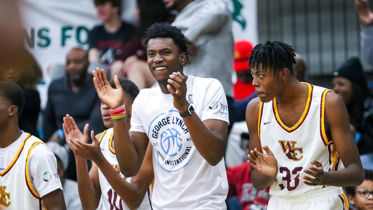 West Charlotte players cheer from the sidelines as the come from behind