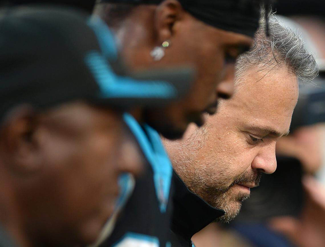 Carolina Panthers head coach Matt Rhule, right, walks off the field following the team’s game against the Tampa Bay Buccaneers on Sunday, December 26, 2021 at Bank of America Stadium in Charlotte, NC. The Buccaneers defeated the Panthers 32-6.