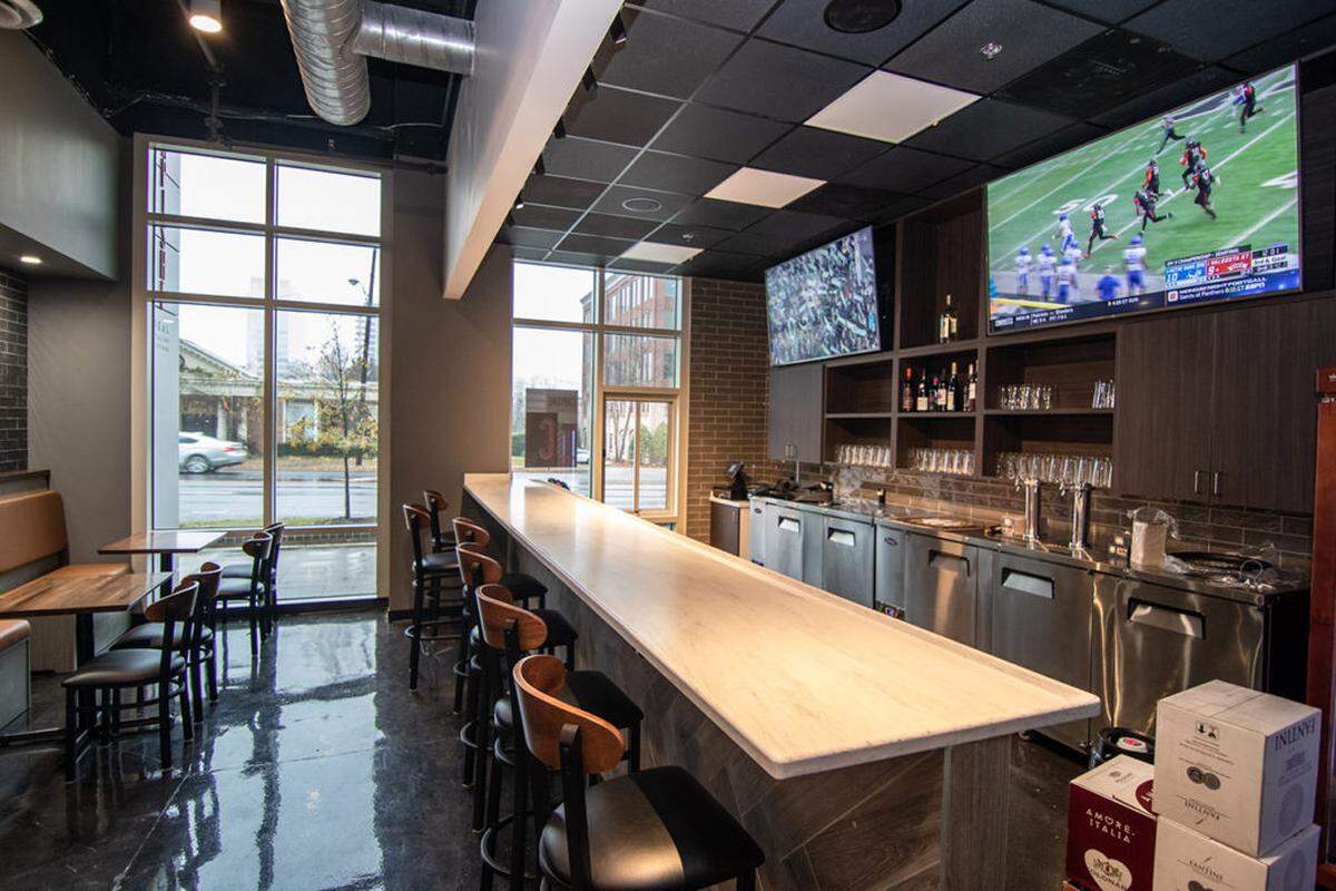 Grab a beer or wine and watch the game at the bar at Capishe.