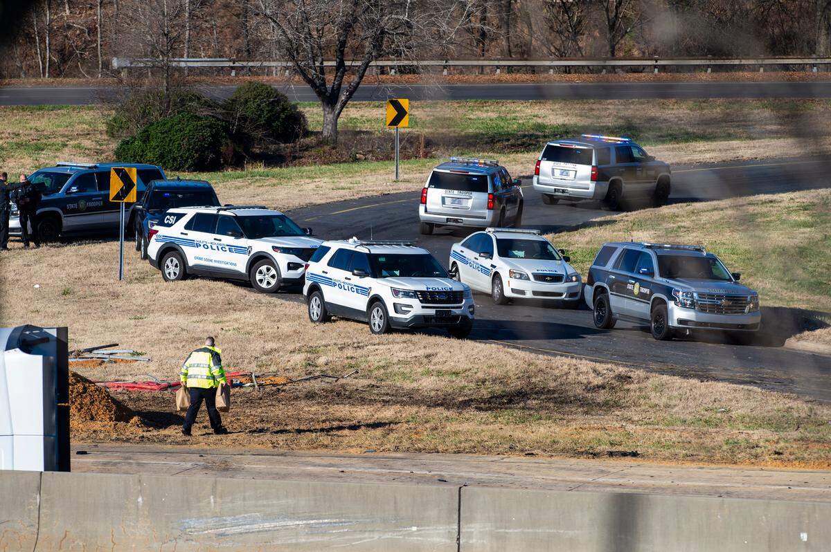 Charlotte-Mecklenburg police and North Carolina State Highway Patrol vehicles close a ramp off Interstate 85 after a crash in the southbound lanes killed police Officer Mia Goodwin and injured three others on Wednesday, December 22, 2021 in Charlotte, NC.