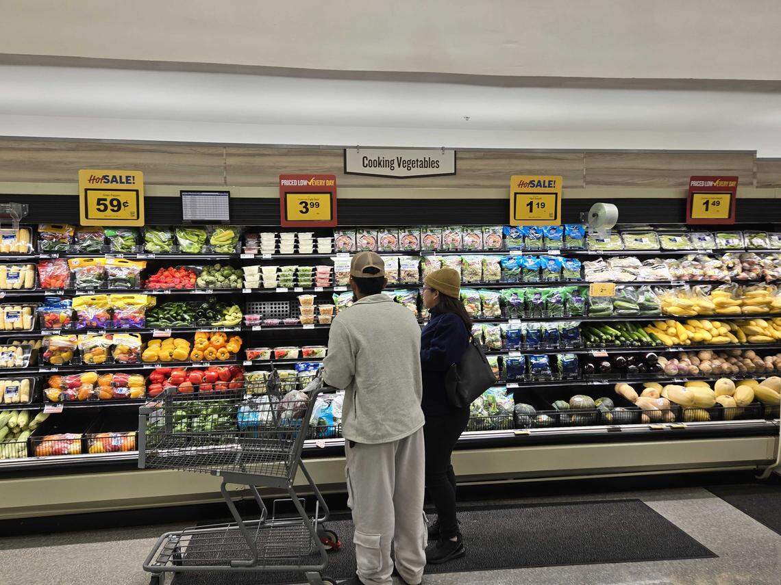 Customers spend time shopping through an upgraded produce section at the Johnston Road Plaza Food Lion.