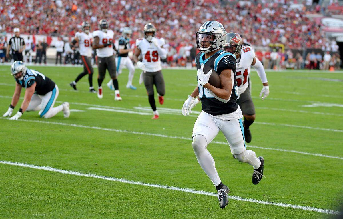 Carolina Panthers running back Chuba Hubbard catches a touchdown pass from quarterback Sam Darnold during first quarter action against the Tampa Bay Buccaneers at Raymond James Stadium in Tampa, Fl. on Sunday, January 9, 2022.