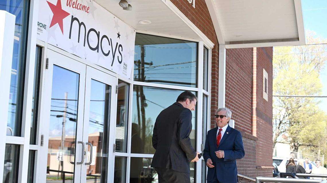 State Rep. Harry Warren, right, talks to F&M Bank CEO Steve Fisher outside of China Grove Town Hall on Thursday. A banner welcoming Macy’s hung outside of the town hall as officials entered to make the economic development announcement.