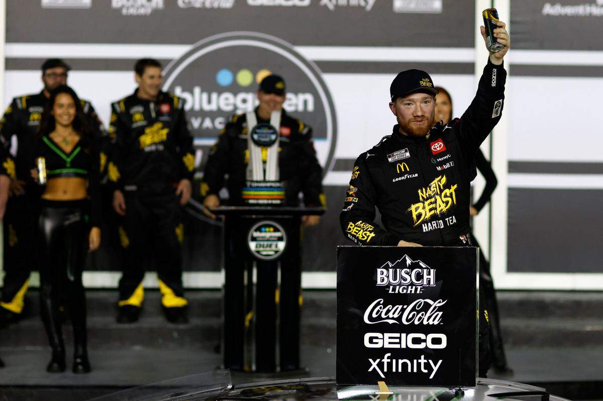 Feb 15, 2024; Daytona Beach, Florida, USA; NASCAR Cup Series driver Tyler Reddick (45) reacts in victory lane after winning the Bluegreen Vacations Duel 1 at Daytona International Speedway. Mandatory Credit: Peter Casey-USA TODAY Sports