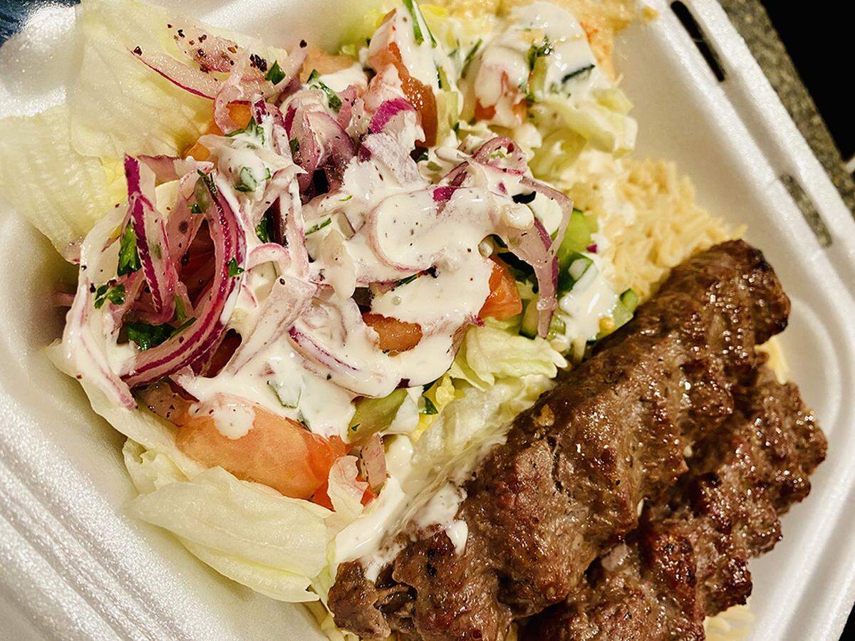A kebab with rice and salad from Halal Street Food.