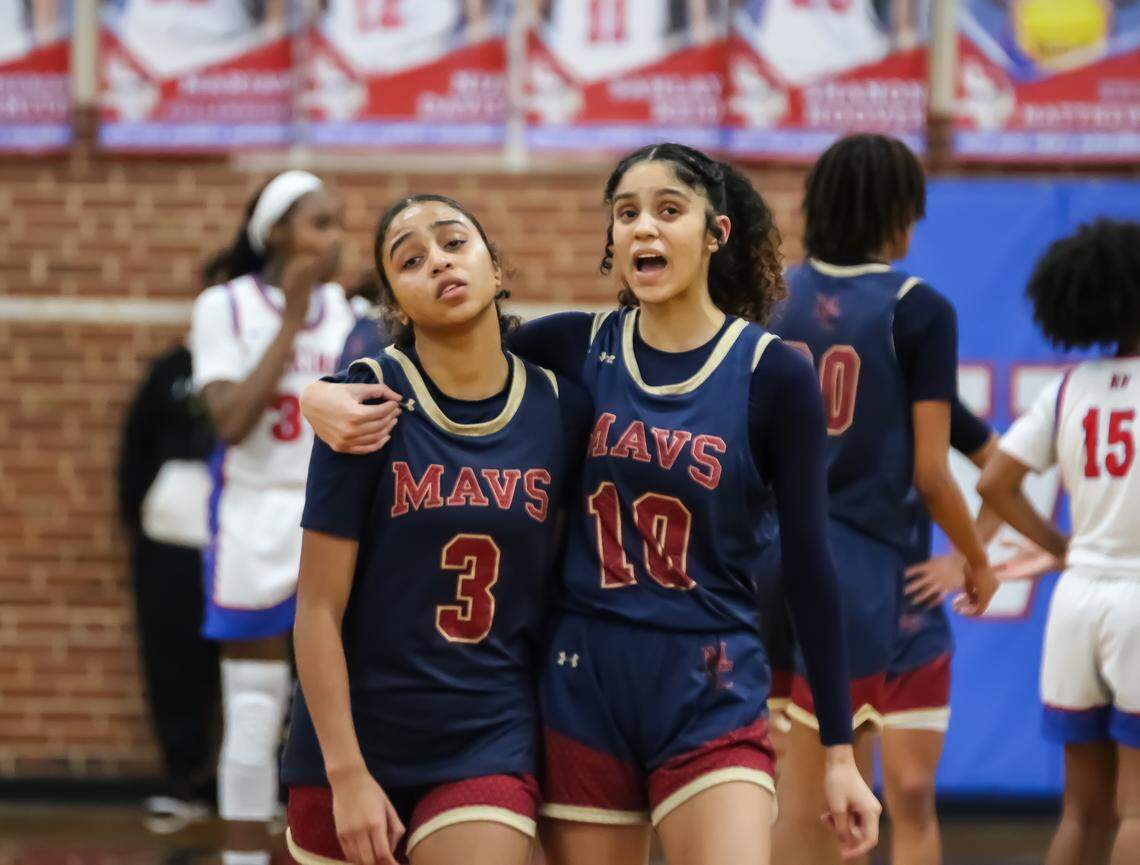 Mallard Creek Elle Stone consoles her sister Jazmeen Stone as they pull off a last minute win against North Meck after Jazmeen fouled at the three point line in the last second