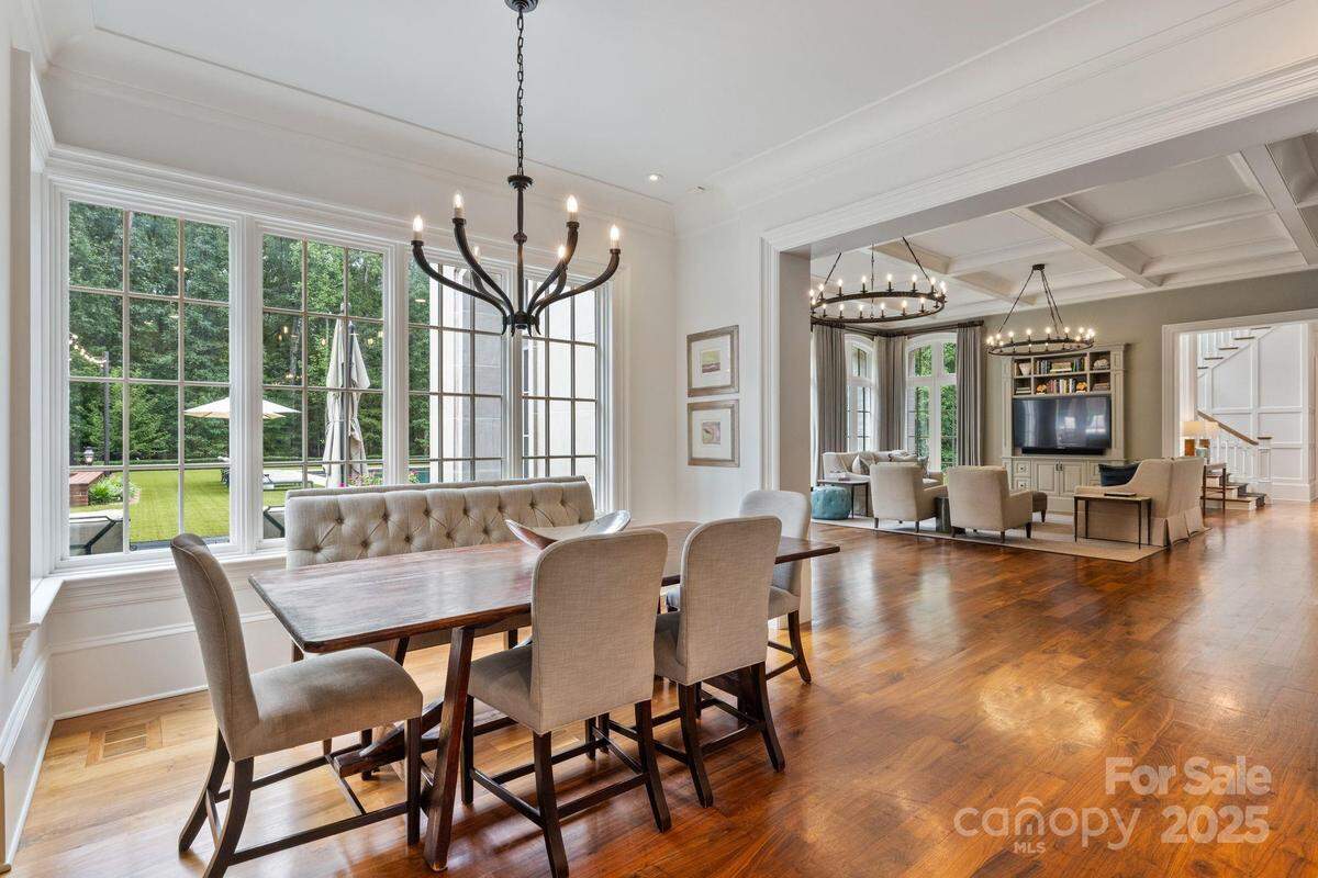 This dining area in Jamie McMurray’s Lake Norman mansion includes views of the outdoors and the spacious  interior of the home. 