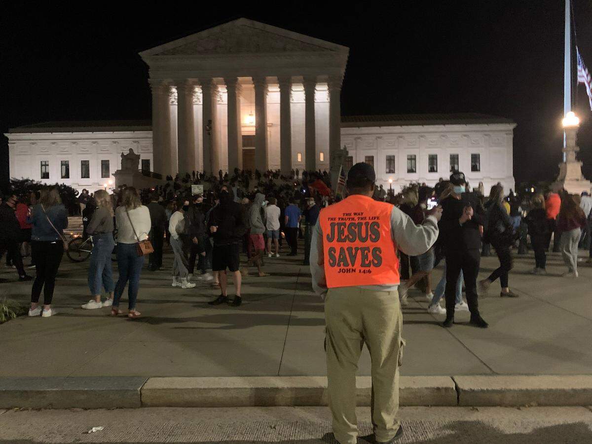 Sam Bethea stands in front of the Supreme Court Building last Friday night, shortly after it was announced that Justice Ruth Bader Ginsburg had died.