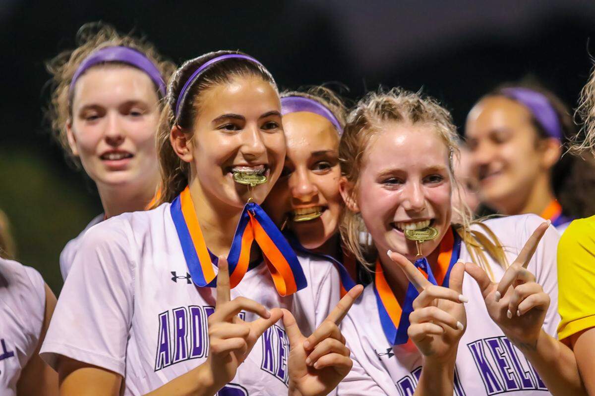 Ardrey Kell players show off their Championship Metals