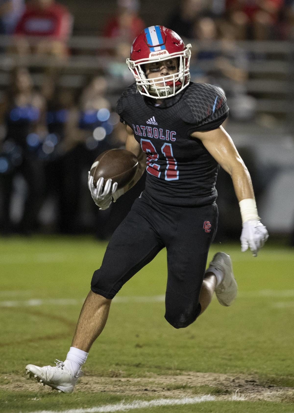 Charlotte Catholic ball carrier Brian Jacobs looks for running room against Weddington during a prep football game at Charlotte Catholic High School Friday, September 28, 2018 in Charlotte, NC. Photo by JASON E. MICZEK - Special to the Observer