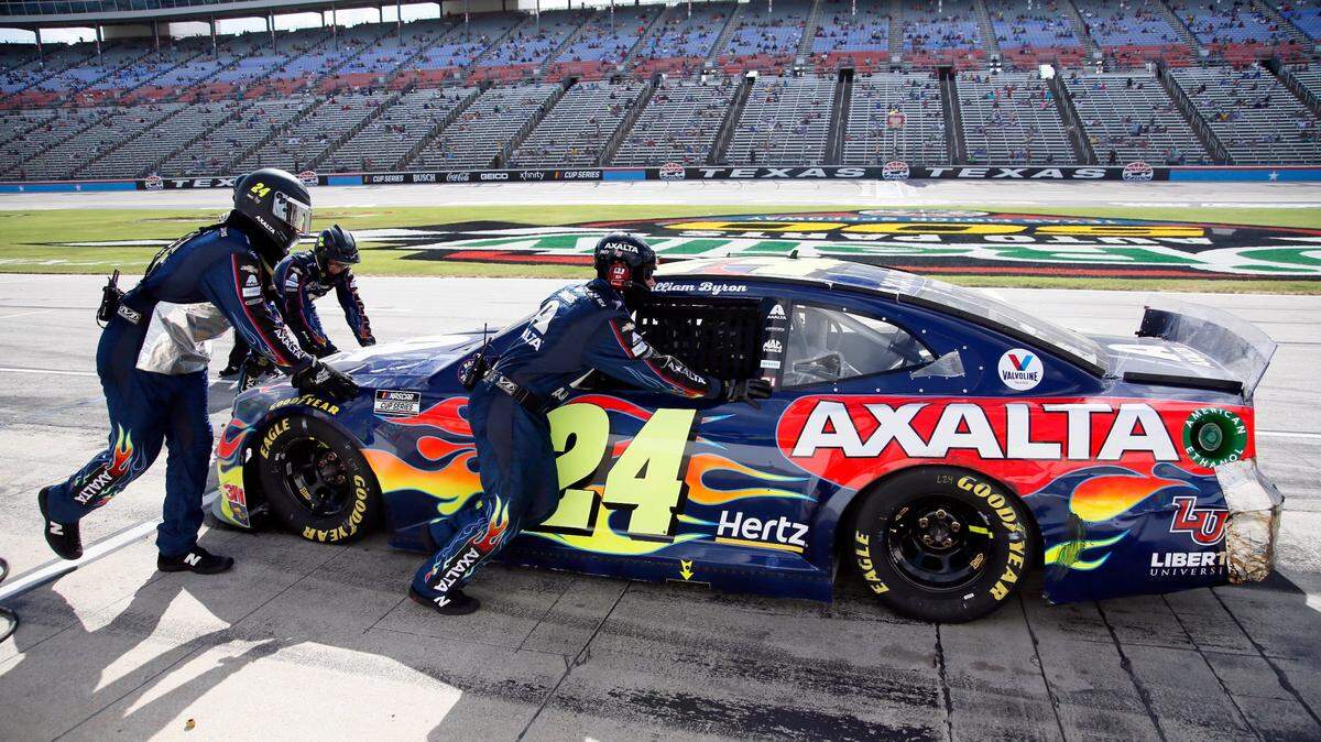 William Byron is pushed from pit road to the garage, ending his day during a NASCAR Cup Series auto race at Texas Motor Speedway in Fort Worth, Texas, Sunday, July 19, 2020. (AP Photo/Ray Carlin)