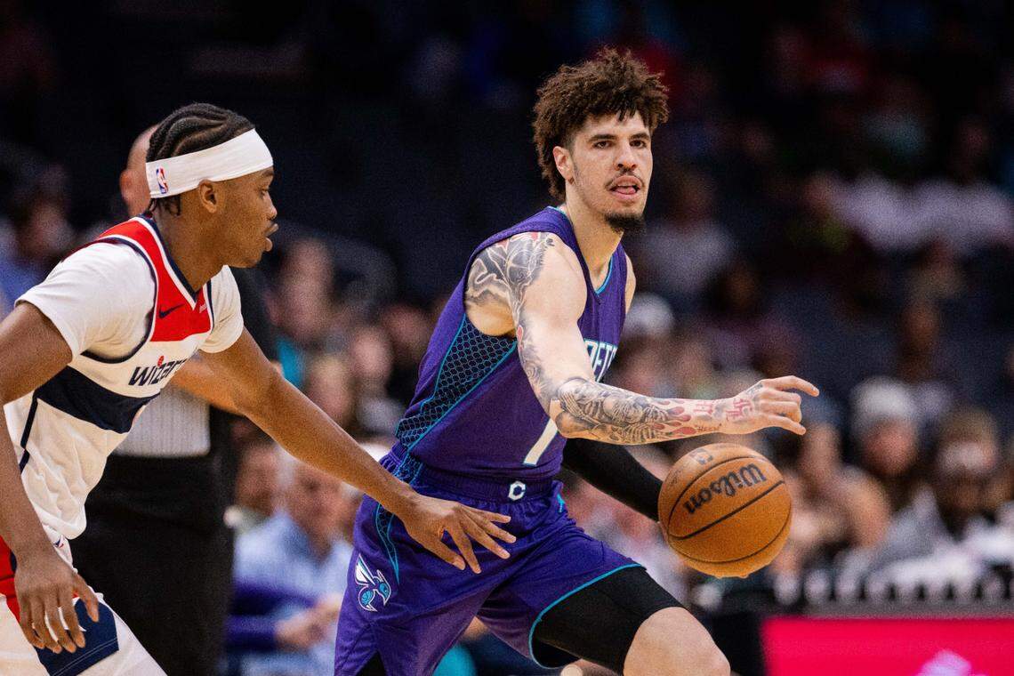 Charlotte Hornets guard LaMelo Ball (1) brings the ball up court against the Washington Wizards during the first quarter at Spectrum Center.