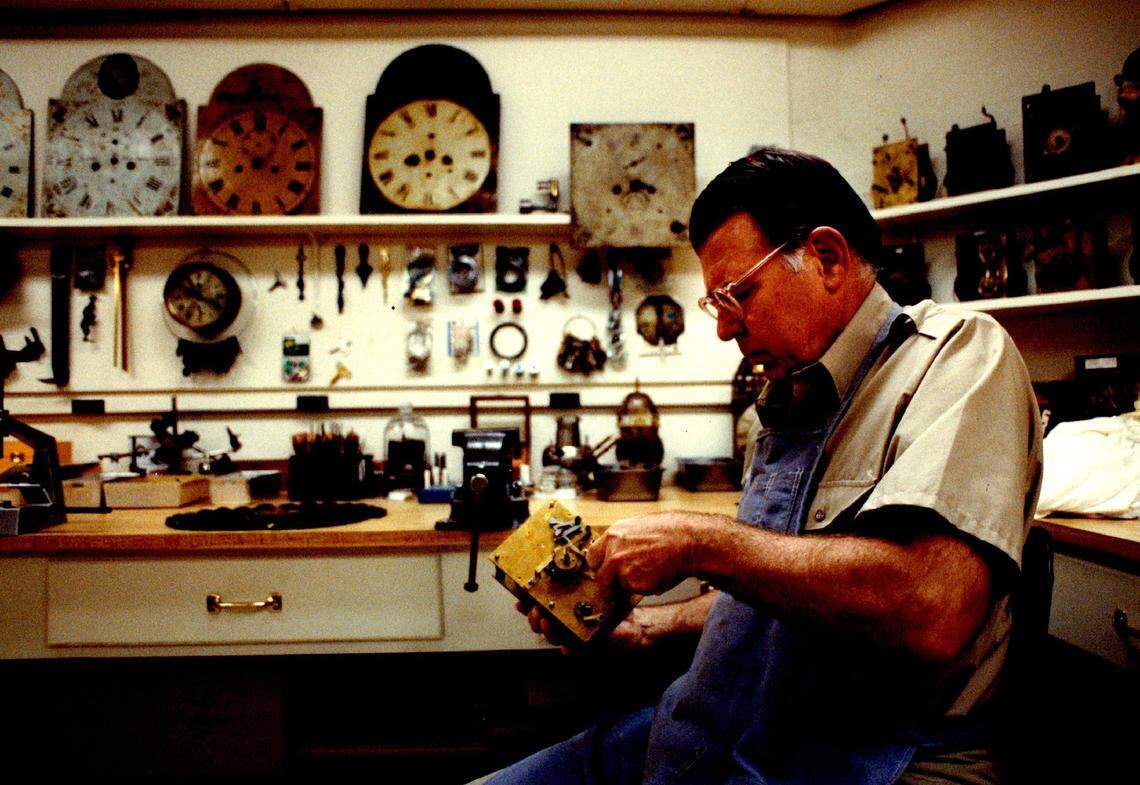 C.D. Dick  Spangler working on a clock in his basement workshop in 1991.  He had many antique and grandfather clocks, some of which dated to the 1600s in Great Britain.