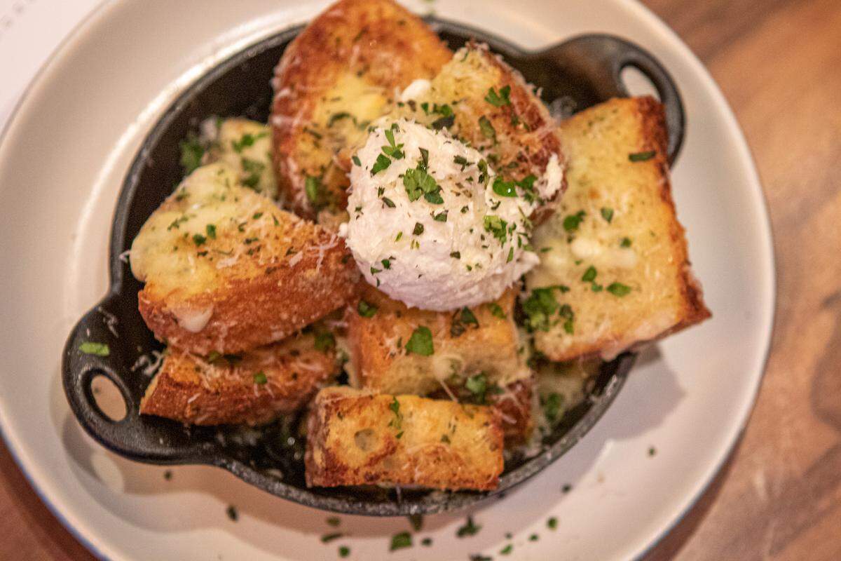 White Truffle Garlic Bread at North Italia: Housemade ricotta, mozzarella, grana padano, herbs.