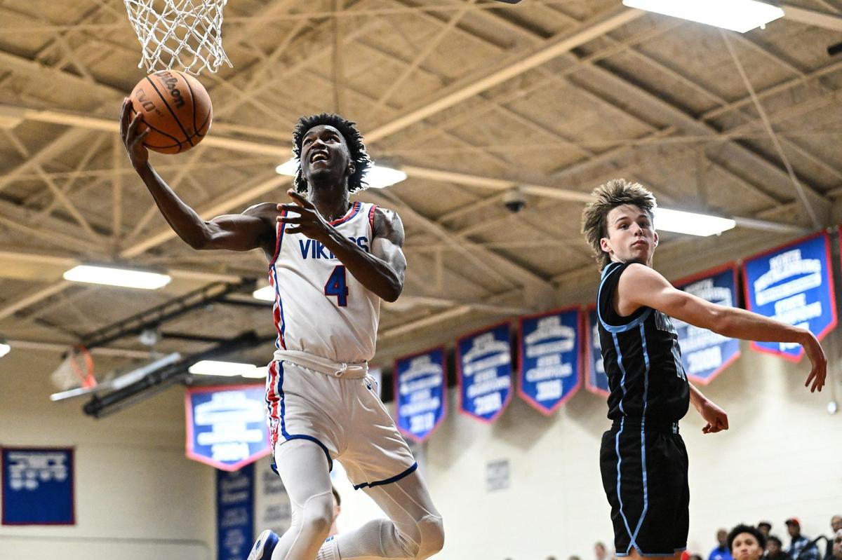 North Mecklenburg’ s Ashton Pierce (4) drives to the basket during the second half of a NCHSAA boys basketball state quarterfinal game against Watauga Friday, March 7, 2025, in Huntersville, N.C. (Charlotte Observer/Matt Kelley)