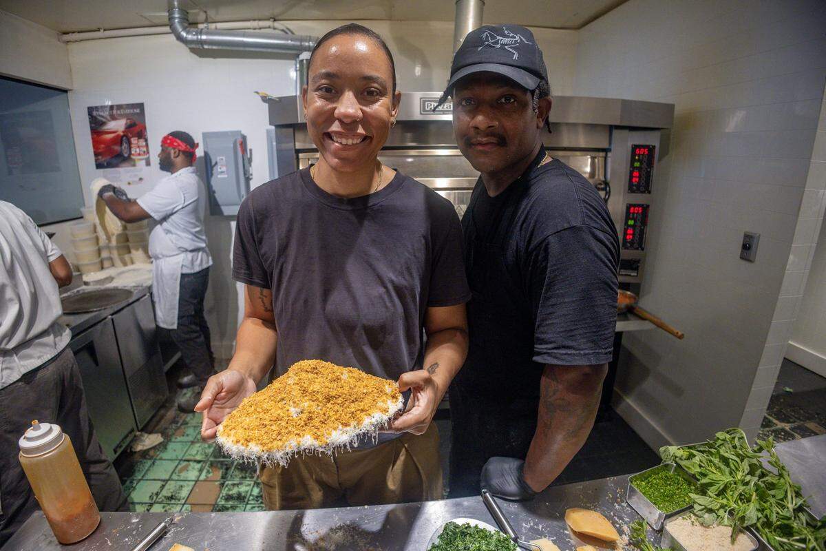 Nkem and Kerrel Thompson, owners of Bird Pizzeria, present their Kale Caesar Salad.