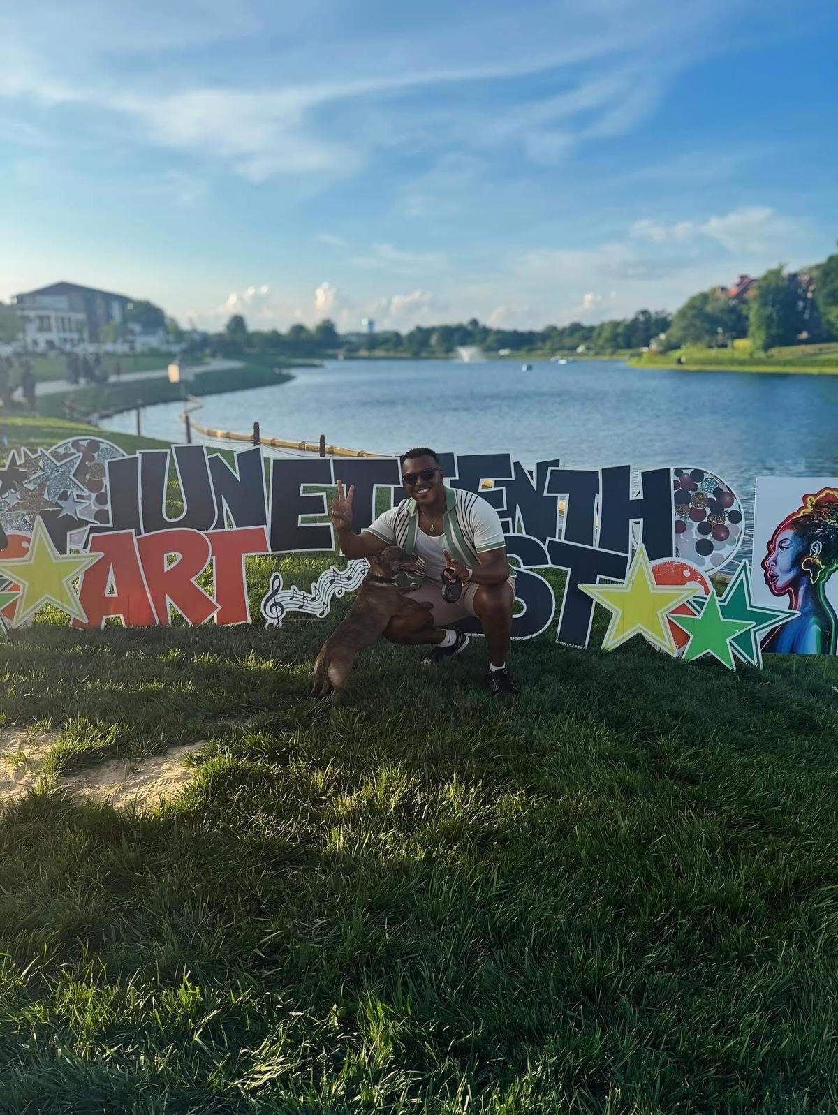 Rogerick Llevon Currie and his dog posing for a photo in front of a Juneteenth sign. Currie was fatally shot on Queen City Drive in west Charlotte on Sept. 7. CMPD won’t comment on why they found his killing “justified.”