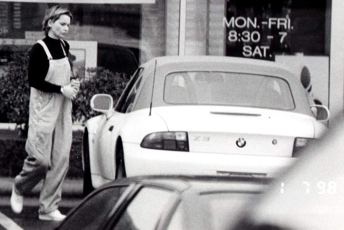 Michelle “Shelley” Chambers appears in this FBI surveillance photo as she approaches a white BMW Z3 she bought with money stolen during the $17 million Loomis Fargo heist.