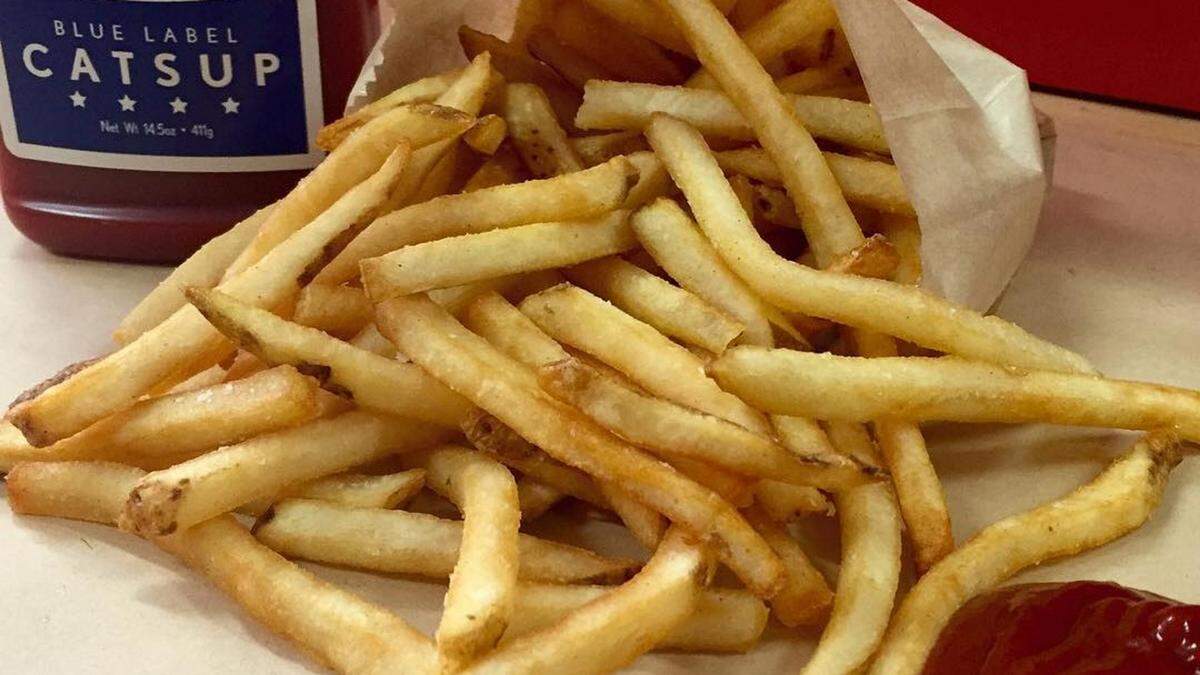 Little Big Burger’s fries are shoestring fries, tossed in white truffle oil and sprinkled with kosher salt.