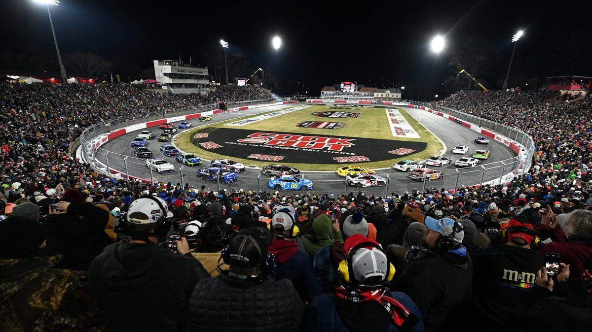NASCAR fans watch the field pass between Turns 1 and 2 during the Cook Out Clash race at Bowman Gray Stadium in Winston-Salem, NC on Sunday, February 2, 2025. Driver Chase Elliott won the race.