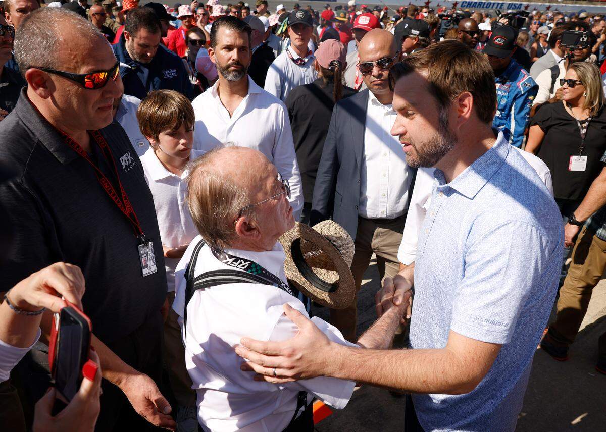 NASCAR team owner Jack Roush, left, shakes hands with Vice Presidential Nominee Senator JD Vance, right, prior to the running of the Bank of America Roval 400 at Charlotte Motor Speedway in Concord, NC on Sunday, October 13, 2024.