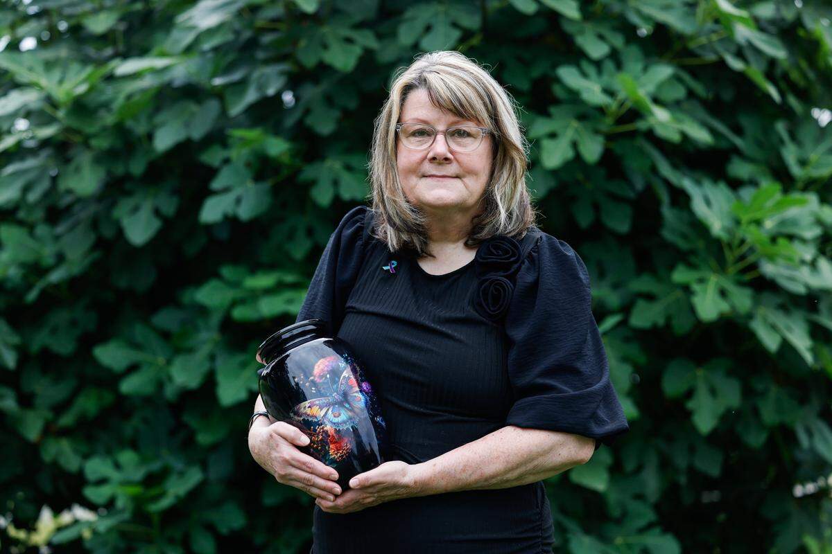 Terri Banks holds an urn with cremated reamins of her daughter, Rachel Anne Banks, who died after hanging herself in the Rowan County jail. Banks had been in the Rowan County jail for less than a week when deputies visited her mother's house on the outskirts of Salisbury. Her daughter had been found unresponsive and was taken to a hospital. Banks' mother would subsequently learn from a doctor that her daughter, 34, a mother of two who struggled with drug addiction, had sought to take her life by hanging herself with a bedsheet on June 12, 2024. She died three weeks later, never regaining consciousness. Neither Rowan County Sheriff Travis Allen nor his staff reached out to the family after Banks' death, her family members said.