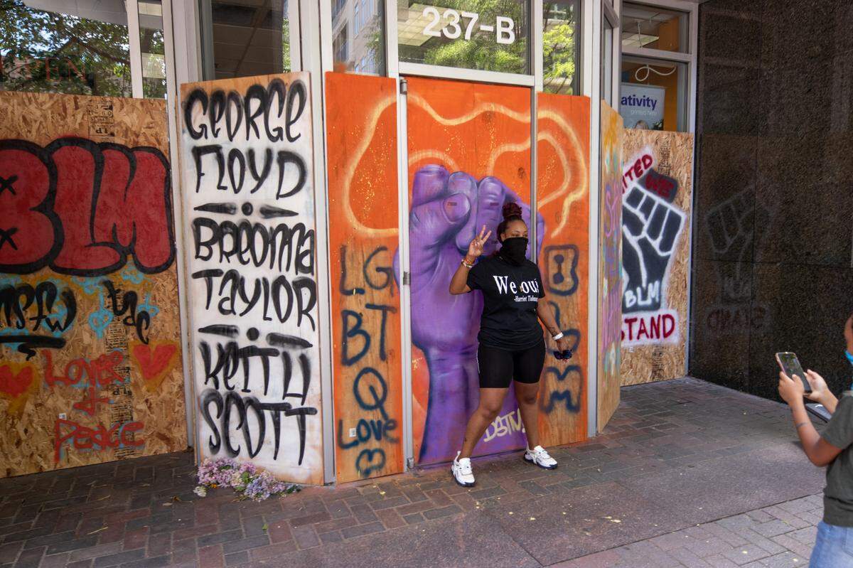 Charlotte Art League is behind the art uptown on boarded-up windows after protests after George Floyd’s death. The intention of the art is to send out positive energy from the boarded windows of businesses uptown.