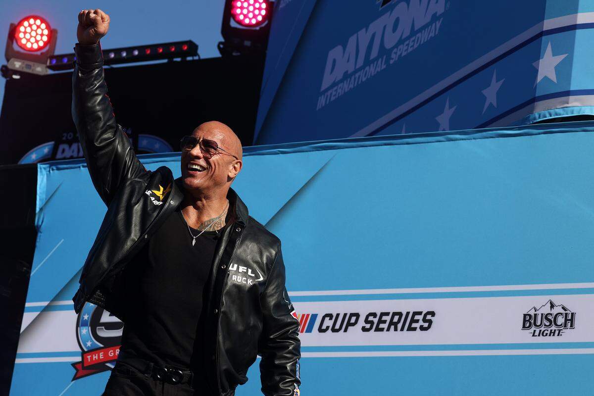 Feb 19, 2024; Daytona Beach, Florida, USA; American actor and Daytona 500 Grand Marshal Dwayne The Rock Johnson during drivers introductions before the Daytona 500 at Daytona International Speedway. Mandatory Credit: Peter Casey-USA TODAY Sports