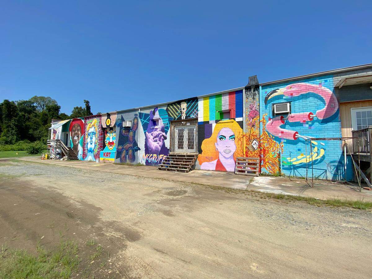 Can Jam mural at 3224 Benard Ave at Unorthodox Studios, variety of artists, changes each year. Artists shown, from left: Noirs One, Garrett Mallekoote, Mark Doepker, Brett Toukatly, Mike Wirth, Matt Moore, Jason Lee Parker, Jen Hill, Stencil Spray, J Bird The Vandal and Darion Fleming, 2020.