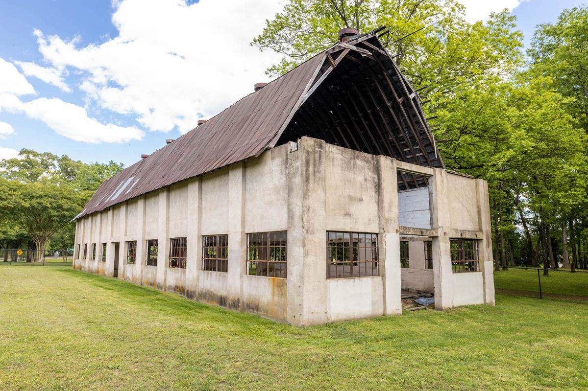 The Barn at MoRA was built in 1932. Its address is listed as 8300 Monroe Road but it is actually on McAlpine Park Drive, one block over.