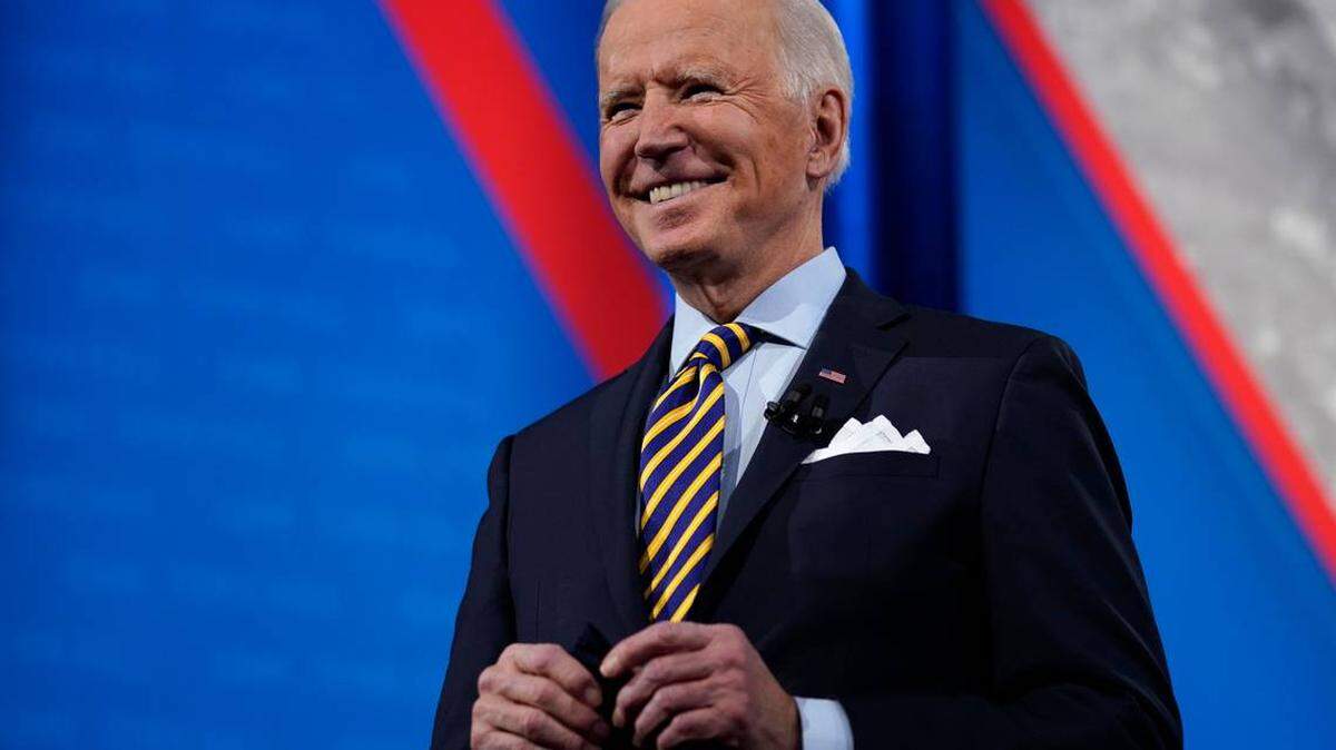 President Joe Biden stands on stage during a CNN town hall this week in Milwaukee. Among the topics Biden addressed was his $1.9 trillion stimulus relief package, which critics say is too costly.