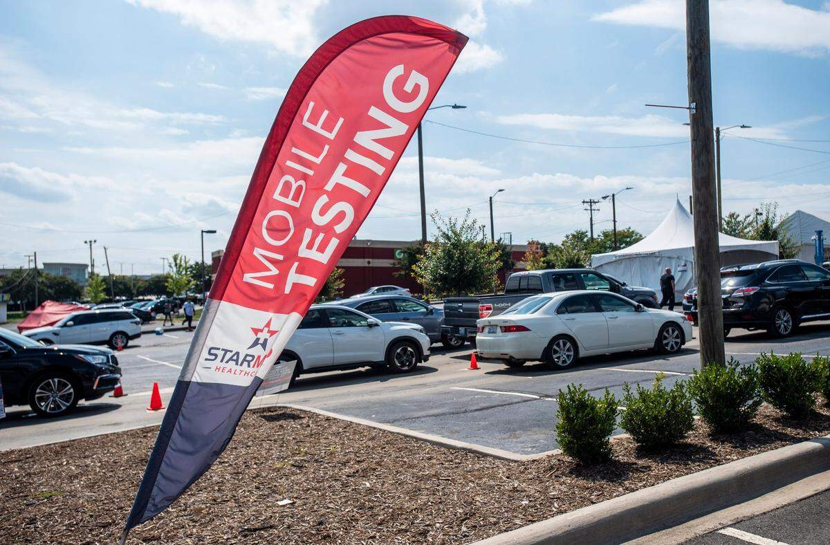 Cars wait in line for drive-thru COVID testing at the StarMed Family & Urgent Care on Tuckaseegee Road. COVID-19 tests have been in high demand in Charlotte in recent weeks.