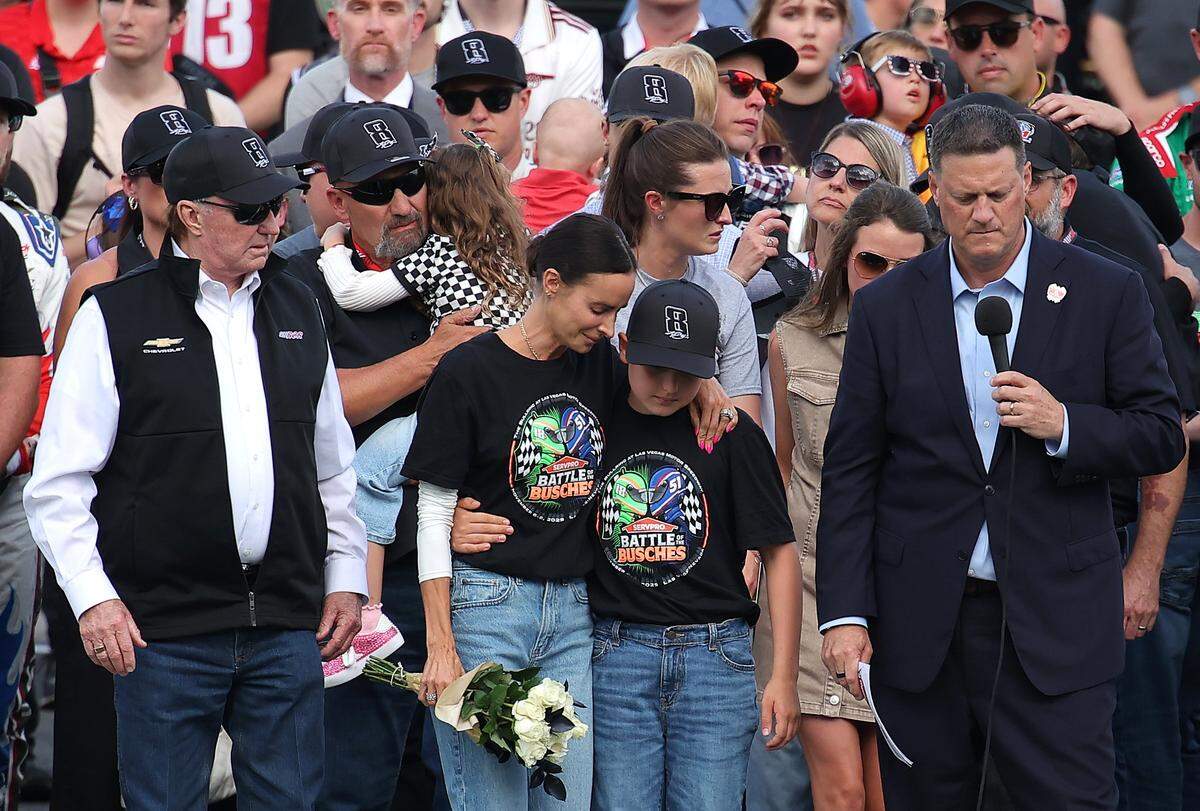 NASCAR Hall of Famer and RCR team owner, Richard Childress, Samantha Busch (wife) Brexton Busch (son) and NASCAR Chief Executive Officer Steve O'Donnell stand on the grid during the remembrance ceremony for Kyle Busch, who passed away suddenly at the age of 41, prior to the NASCAR Cup Series Coca-Cola 600 at Charlotte Motor Speedway on May 24, 2026 in Concord.