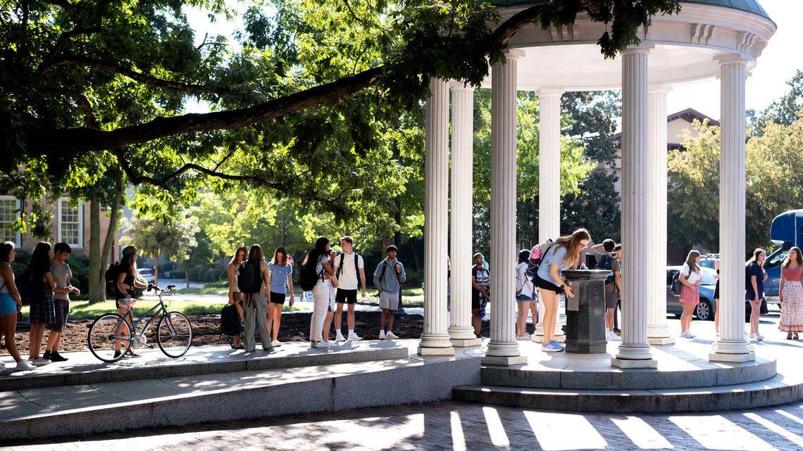 Students at The Old Well on UNC Chapel Hill’s campus.