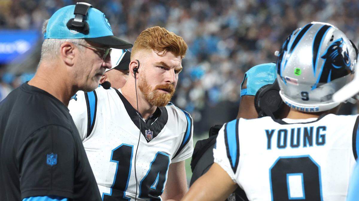 Carolina Panthers head coach Frank Reich, left, quarterback Andy Dalton, center, listen to quarterback Bryce Young, right, during a timeout in action against the New Orleans Saints at Bank of America Stadium on Monday, September 18, 2023. The Panthers lost to the Saints 20-17.