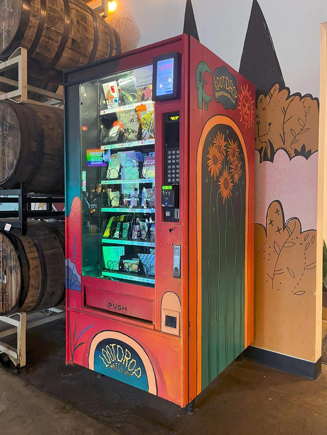 Vending machines that dispense low-cost art are popping up across the Charlotte region, Western N.C. and other parts of the country. This one is from Loot Drop Art Club.