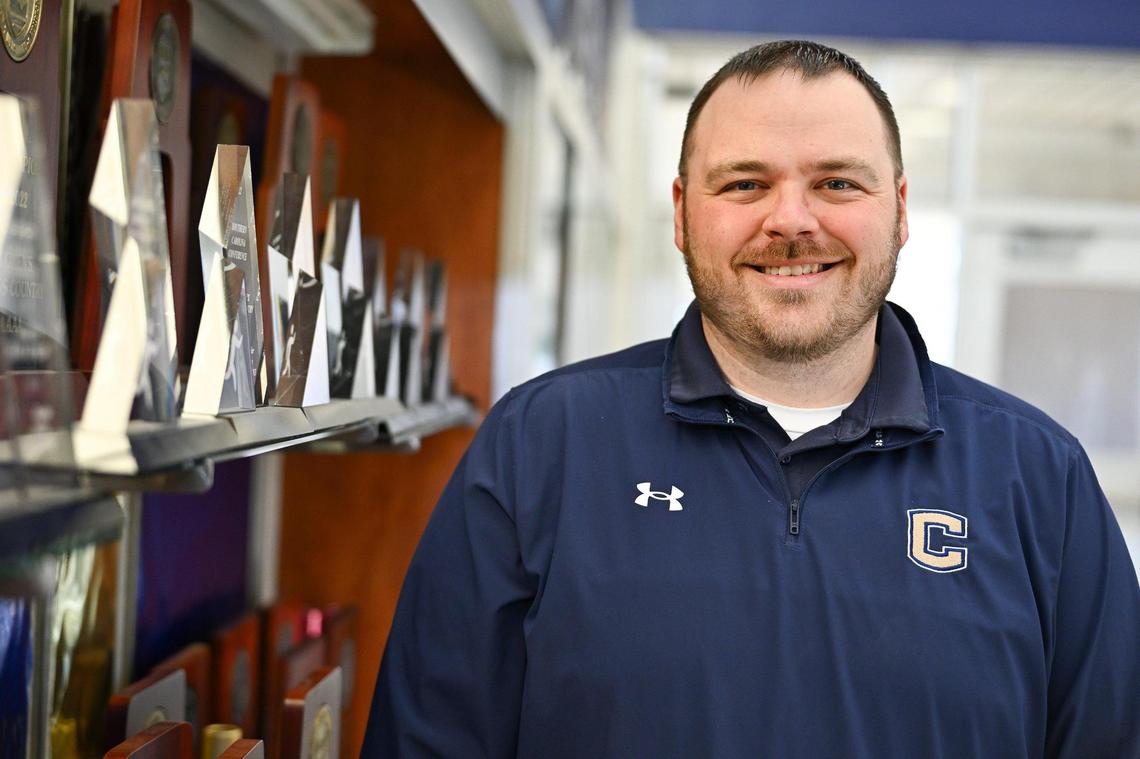 Cuthbertson Director of track and field Dustin Allen poses for a photo, Monday, Feb. 17, 2024, in Waxhaw, N.C. (Charlotte Observer/Matt Kelley)