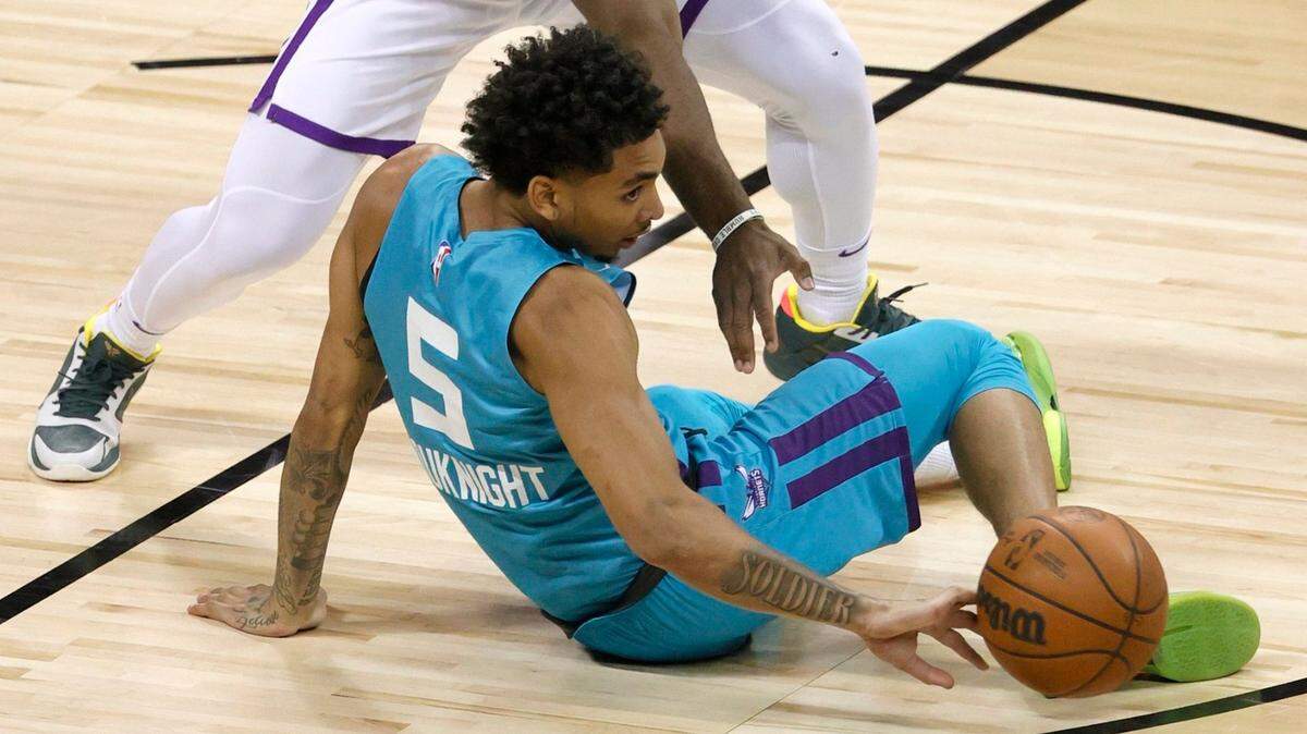 LAS VEGAS, NEVADA:  James Bouknight (5) of the Charlotte Hornets loses the ball to Davion Mitchell of the Sacramento Kings during the 2021 NBA Summer League at the Thomas & Mack Center on August 9, 2021 in Las Vegas, Nevada. (Photo by Ethan Miller/Getty Images)