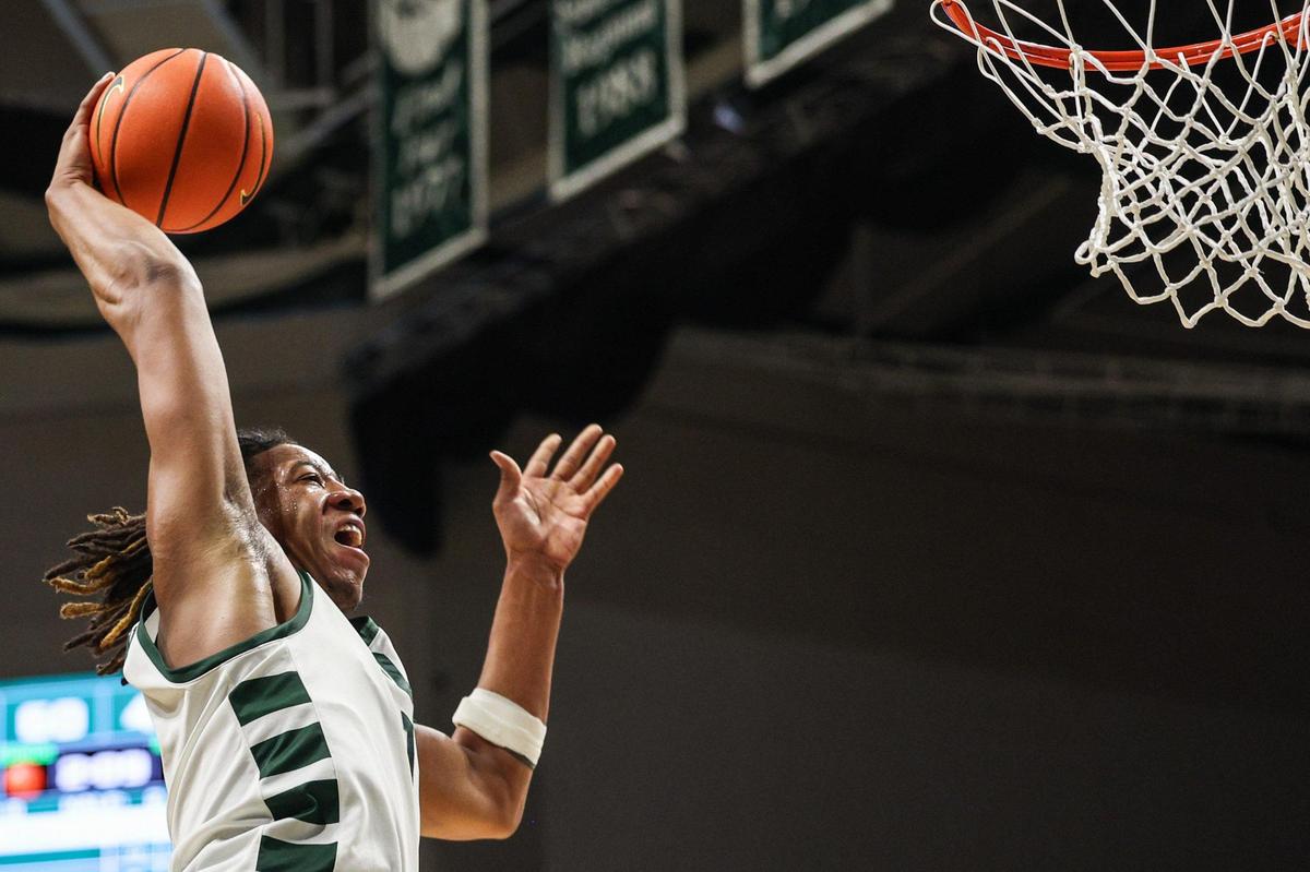 Charlotte 49ers center Dishon Jackson (1) flies to the basket for a dunk late in the team’s win over East Carolina Saturday.