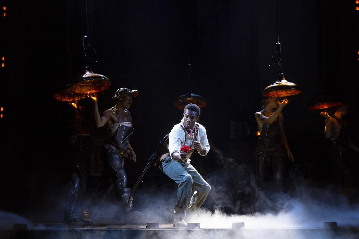 Orpheus (Chibueze Ihuoma) is working to save his love, Eurydice from the underground world of “Hadestown.” He’s holding the show’s iconic red rose.